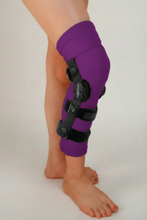 Load image into Gallery viewer, Under Sleeve in purple with knee brace over cover.